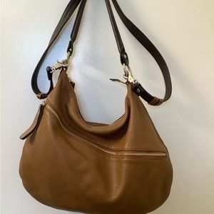 Brown tan cognac Danier Leather crossbody purse.